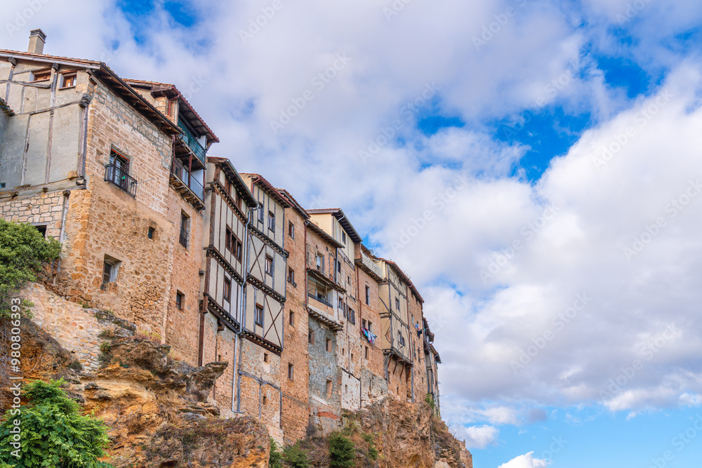 Awe view of the Hanging Houses in Frias, Spain, on top of a cliff Awe view of the Hanging Houses in Frias, Spain, on top of a cliff