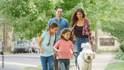 Smiling Family Outdoors Wal...