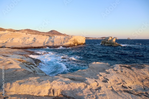 Fototapeta Naklejka Na Ścianę i Meble -  Sunrise in Greece, Sunrise at Sarakiniko, Sunrise at the Beach, Water, Greece Landscape, Sarakiniko Beach, Moon Beach, Greece, Europe, Summer, Background, Wave, Sunrise