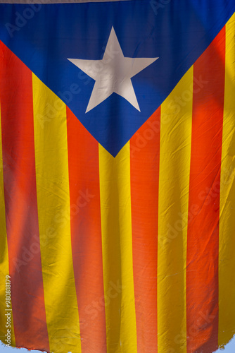Canvas Print Catalan flag hanging between houses