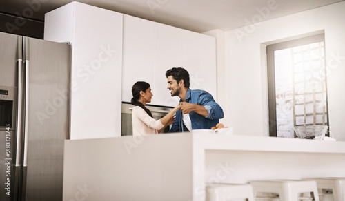 Couple, home and happy in kitchen with dancing for fun, bonding and support as lovers. People, relationship and smile or laughing with music for care, trust and affection on break as soulmates