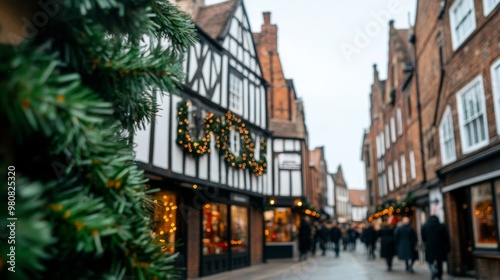 Christmas market at the Shambles in York, with medieval buildings, festive garlands, and cheerful crowds under twinkling lights 