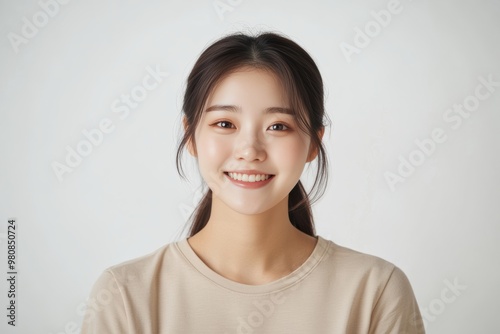 Portraits of Asian women in simple casual attire, standing against plain white background, wear minimal makeup display natural expressions, emphasizing modern, everyday style.