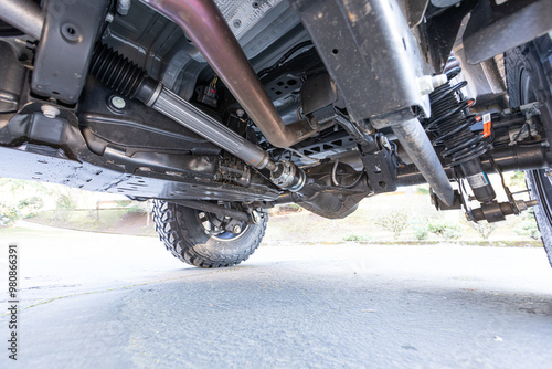 American 4x4 old vintage classic off-road truck rusty strong underneath picture axles shock absorbers yoke differentials muffler. high quality picture for download