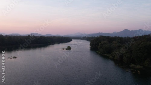 Drone Shot from top view showing river and forst sunset time photo