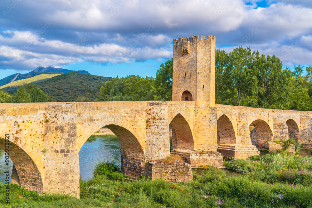 View of the medieval bridge in the historic village of Frías, Spain, over the River Ebro, built in Gothic style in the 13th century View of the medieval bridge in the historic village of Frías, Spain, over the River Ebro, built in Gothic style in the 13th century
