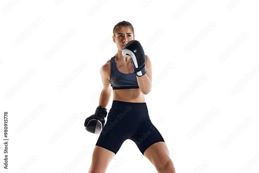 Combat sport school. Young woman, boxing athlete showing skills and focus during training session isolated on white studio background. Concept of sport, hobby, active and healthy lifestyle Combat sport school. Young woman, boxing athlete showing skills and focus during training session isolated on white studio background. Concept of sport, hobby, active and healthy lifestyle