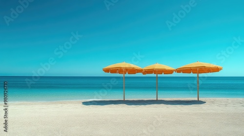 Quiet Beach Scene: Striped Umbrellas Under Blue Sky