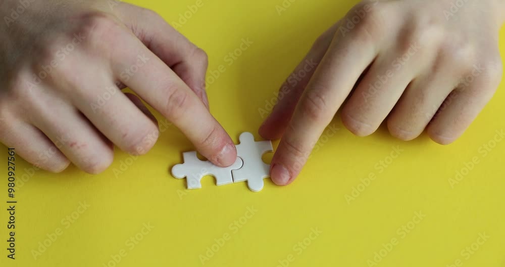Two white blank puzzle pieces on yellow background Merging different elements into whole Two white blank puzzle pieces on yellow background Merging different elements into whole