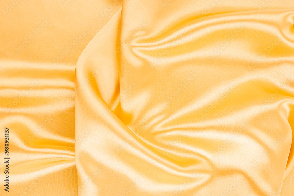 Yellow silk satin. Draped fabric. golden color. Luxury background. Yellow silk satin. Draped fabric. golden color. Luxury background.