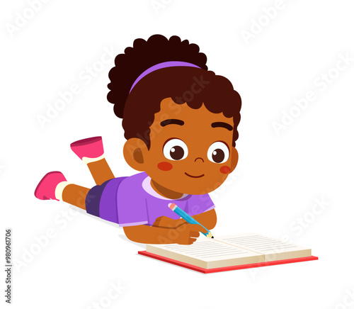 little kid writing a book while lying on stomach on the floor