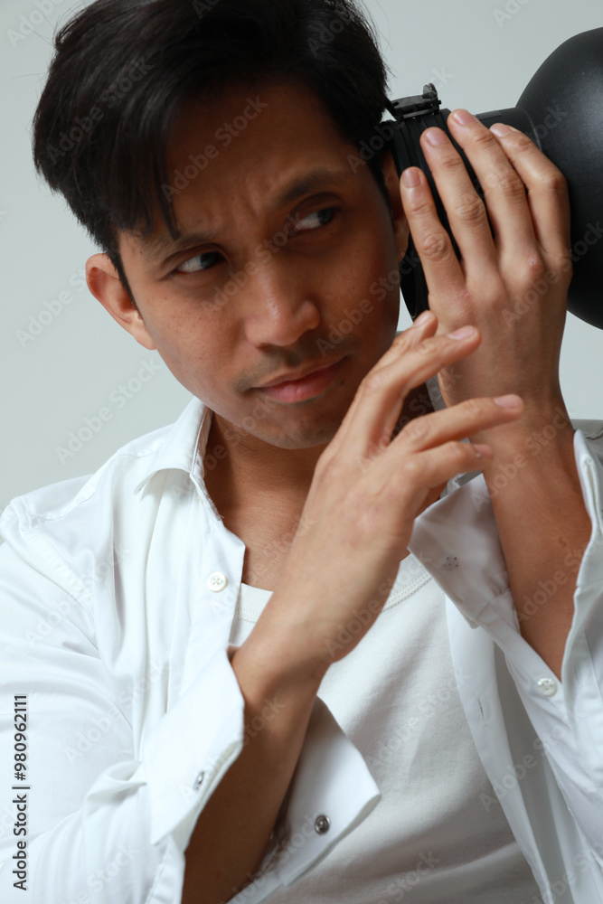 Close-up portrait of thoughtful smart man posing over white background. Vertical. Close-up portrait of thoughtful smart man posing over white background. Vertical.