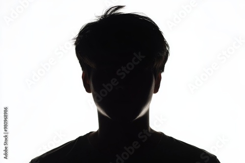 An anonymous adult young man appears on a white background photo