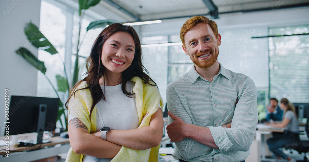 Fotografie Two people standing side by side and confidently looking directly at camera
