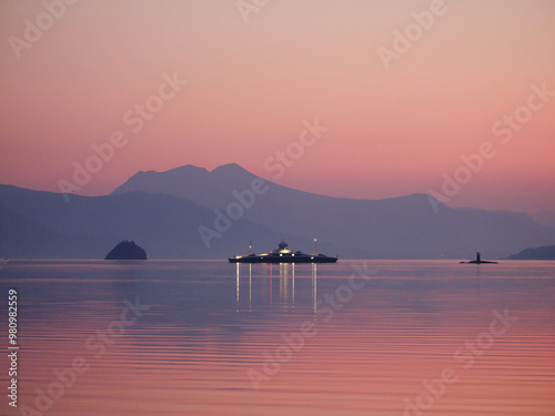 Ferry in sunset photo