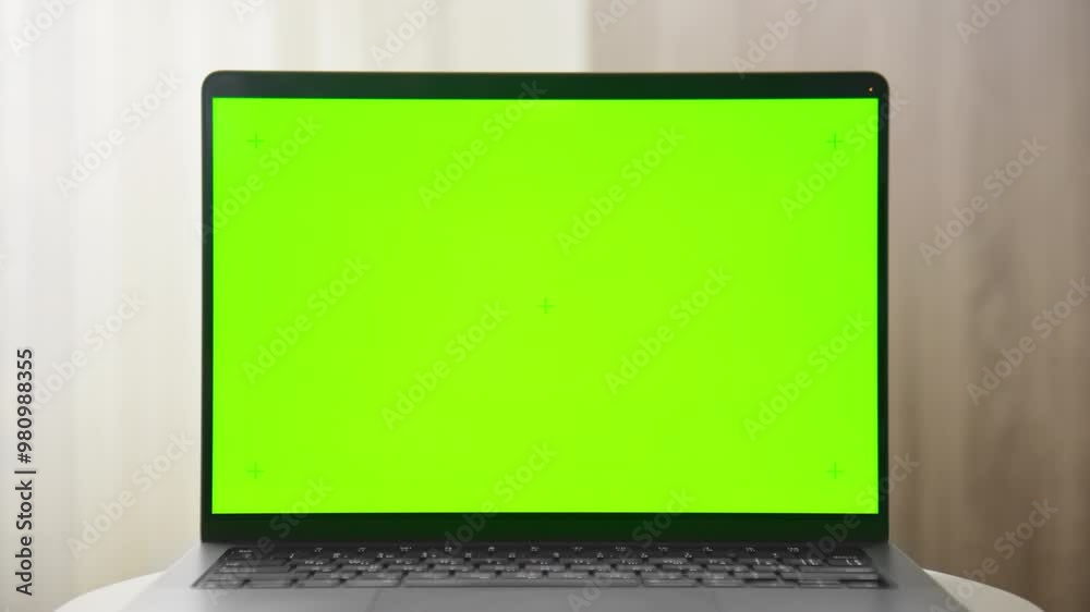 Fly in Laptop with green screen placeholder on a white table Fly in Laptop with green screen placeholder on a white table