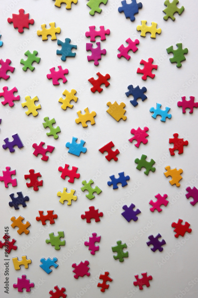 Colorful jigsaw puzzle pieces on white background. Flat lay. Colorful jigsaw puzzle pieces on white background. Flat lay.