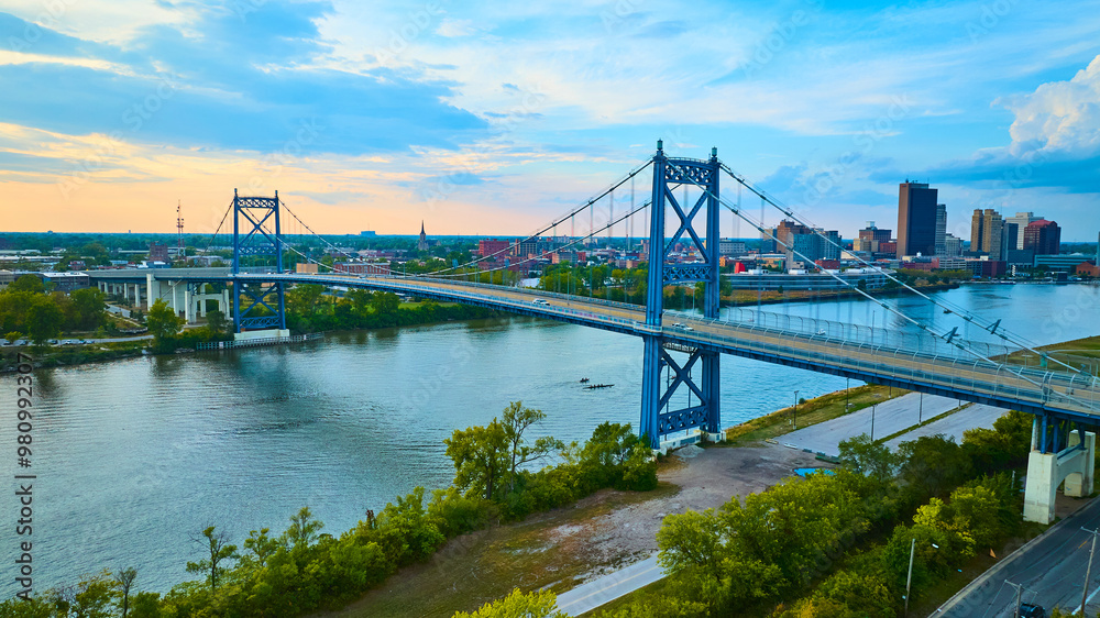 Naklejka premium Aerial View of Anthony Wayne Bridge at Sunset Over Maumee River in Toledo