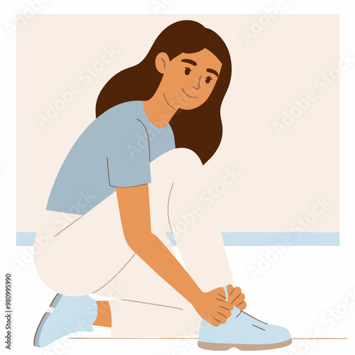 A woman is sitting on the floor and putting on her shoes. She is smiling and she is in a good mood