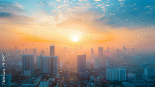 City skyline with modern buildings under a vibrant sunrise and colorful clouds