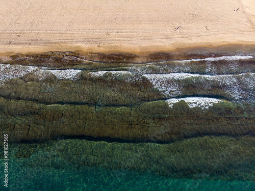 Obraz na płótnie Aerial photo of the beautiful beach taken in the town of Benidorm in Spain, showing a top view of a typical Spanish beach w salonie