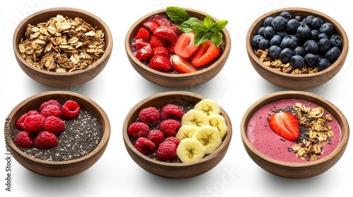 A vibrant display of healthy bowls filled with granola, berries, and banana, perfect for a nutritious breakfast or snack.