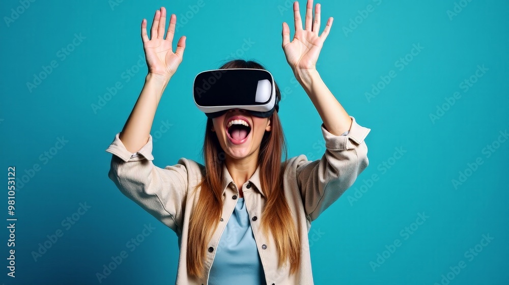 Joyful Woman Experiencing Virtual Reality With Hands Up On Blue Backdrop Joyful Woman Experiencing Virtual Reality With Hands Up On Blue Backdrop