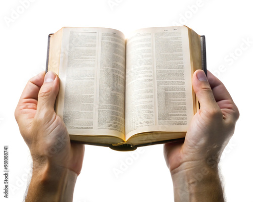 two hands hold an open bible