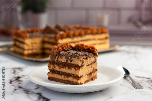 sweet dessert choco cake with chocolate cookies dulce de leche cream cheese on kitchen counter decorated with broken chocolate