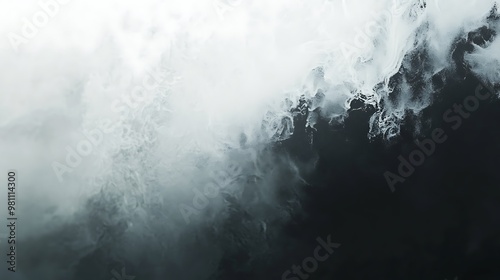 A dramatic view of turbulent ocean waves blending with misty clouds.