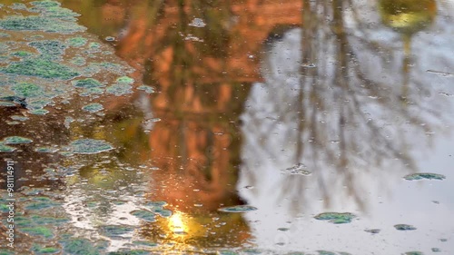 Reflection in water of Church of St. Michael the Archangel. Gethsemane Chernigov Skit is courtyard of Holy Trinity St. Sergius Lavra, monastery of Russian Orthodox Church. Sergiev Posad, Russia.
