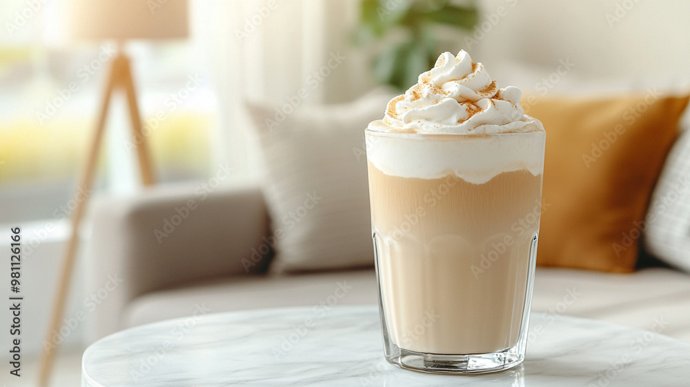 Creamy coffee drink topped with whipped cream, perfect for cozy moments