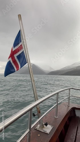 Slow Motion Journey Through Icelandic Fjords from the Bow of a Boat – Breathtaking Scenery in Motion. Vertical video photo