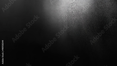 Mysterious abstract texture of black mist softly illuminated to create depth and intrigue in a dark setting