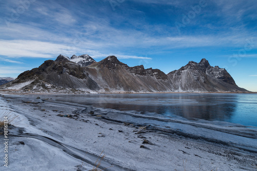 Snow cover black beach and Vesturhorn Mountain in Winter, Iceland. photo