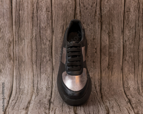 Elegant sneaker in eco-leather, black and gold, seen above, for casual use