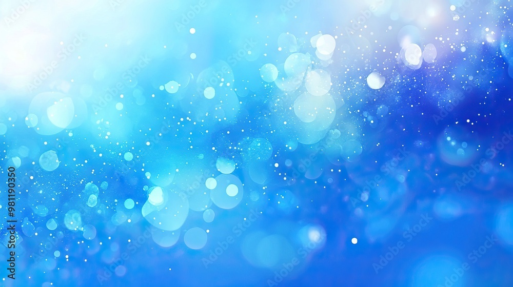 Obraz premium A serene blue background with sparkling light bokeh, perfect for calming designs and creative projects.