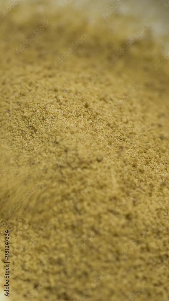Dehydrated sap of the coconut palm tree. Coconut sugar pouring on white table Dehydrated sap of the coconut palm tree. Coconut sugar pouring on white table