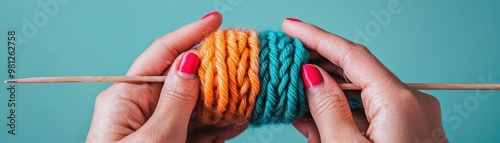 A close-up view of hands holding colorful yarn, showcasing vibrant knitting textures and craftsmanship.