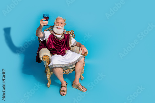 Photography Full body portrait of rich wealthy ancient roman citizen sit throne hold wine gl