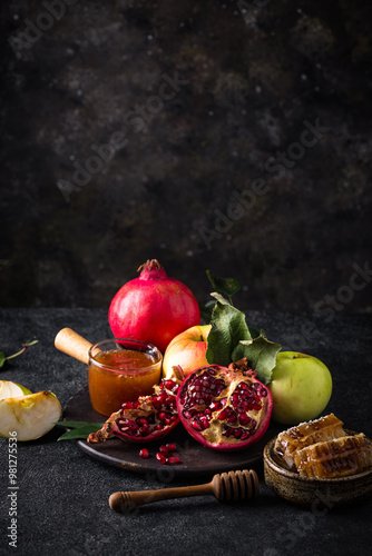 Photography Rosh Hashana concept with honey, apple and pomegranate