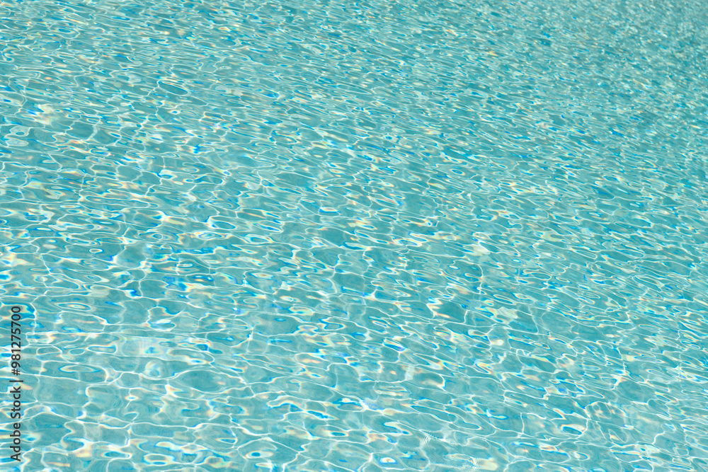 Ripple water in summer pool. Sea surface background. Vacation resort water background. Sea beach. Summer vacation at ocean shore. Blue ocean rippled water texture reflection. Poolside relaxation Ripple water in summer pool. Sea surface background. Vacation resort water background. Sea beach. Summer vacation at ocean shore. Blue ocean rippled water texture reflection. Poolside relaxation
