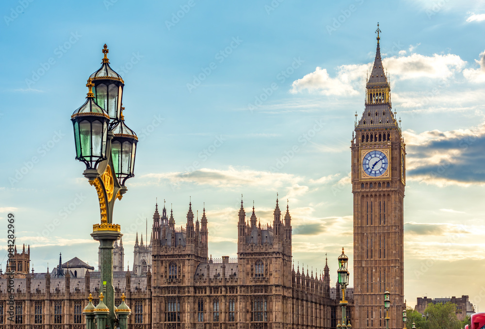 Fototapeta premium Big Ben tower and street lamp on Westminster bridge at sunset, London, UK
