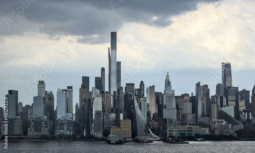 view of midtown manhattan frm weehawken waterfront (hudson river west new york city skyline skyscrapers sightseeing travel tourism destination) nyc dramatic sky harbor vista scenic buildings nj jersey #981293319