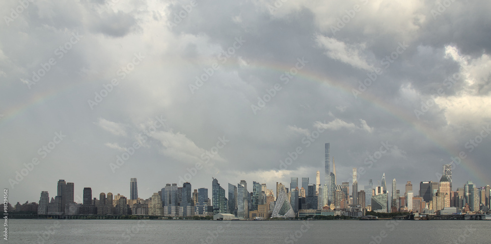 rainbow over the west side of manhattan new york city skyline (residential and commercial skyscraper buildings) view from nj nyc panorama rain bow colorful sky after rain apartment real estate rainbow over the west side of manhattan new york city skyline (residential and commercial skyscraper buildings) view from nj nyc panorama rain bow colorful sky after rain apartment real estate