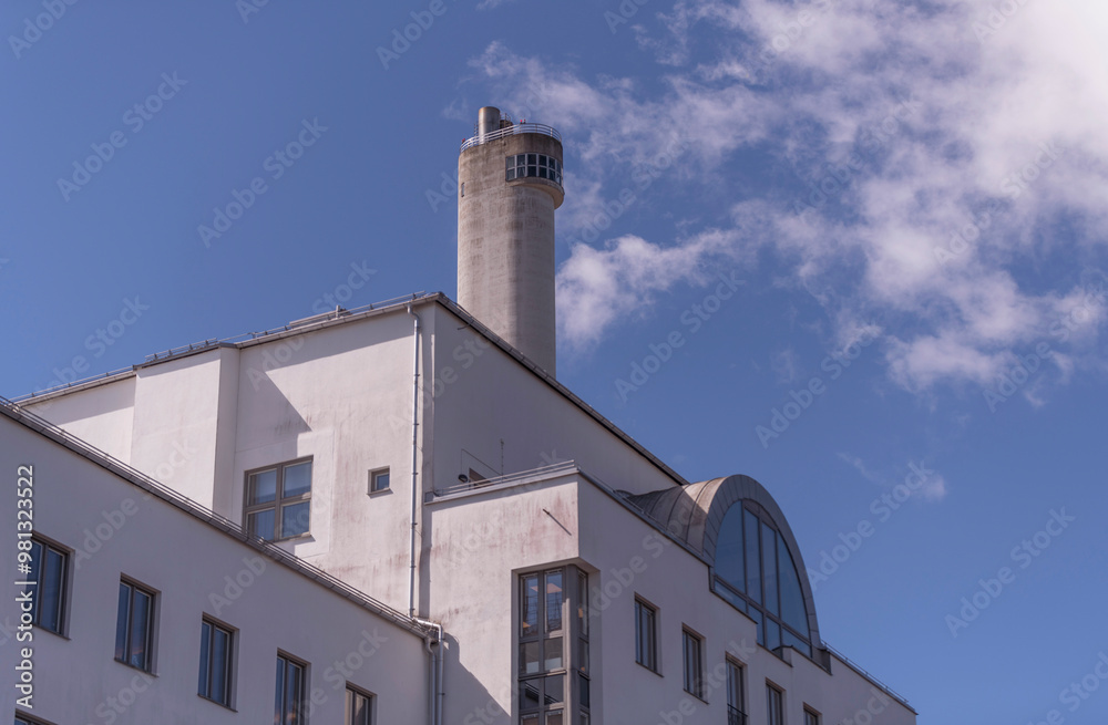 Different shapes of house facades and a chimney with outlook, a sunny summer day in Stockholm Different shapes of house facades and a chimney with outlook, a sunny summer day in Stockholm