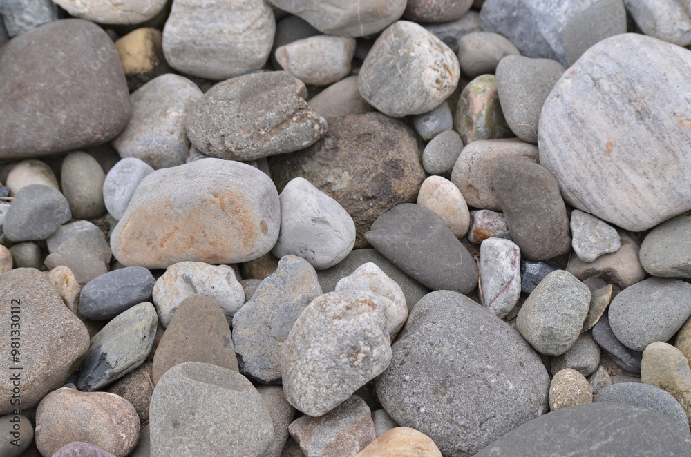 Close-up texture image of river rocks of differing sizes Close-up texture image of river rocks of differing sizes