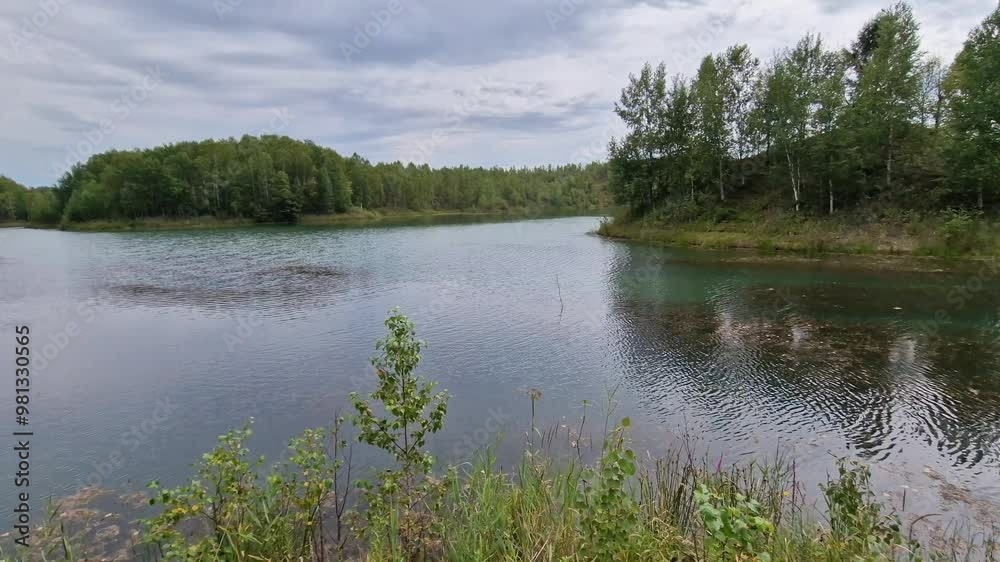 Beautiful calm green lake on a summer day. Beautiful calm green lake on a summer day.