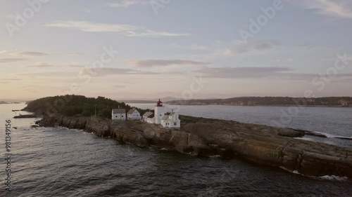 Drone Arc Captures Langoytangen Lighthouse And Rugged Rocks photo