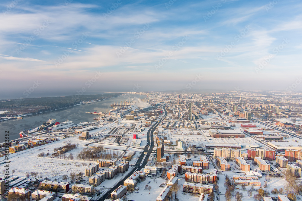 Aerial view of Klaipeda city port area and it's surroundings on sunny winter evening. The Old town of Klaipeda, Lithuania in evening light at wintertime.
